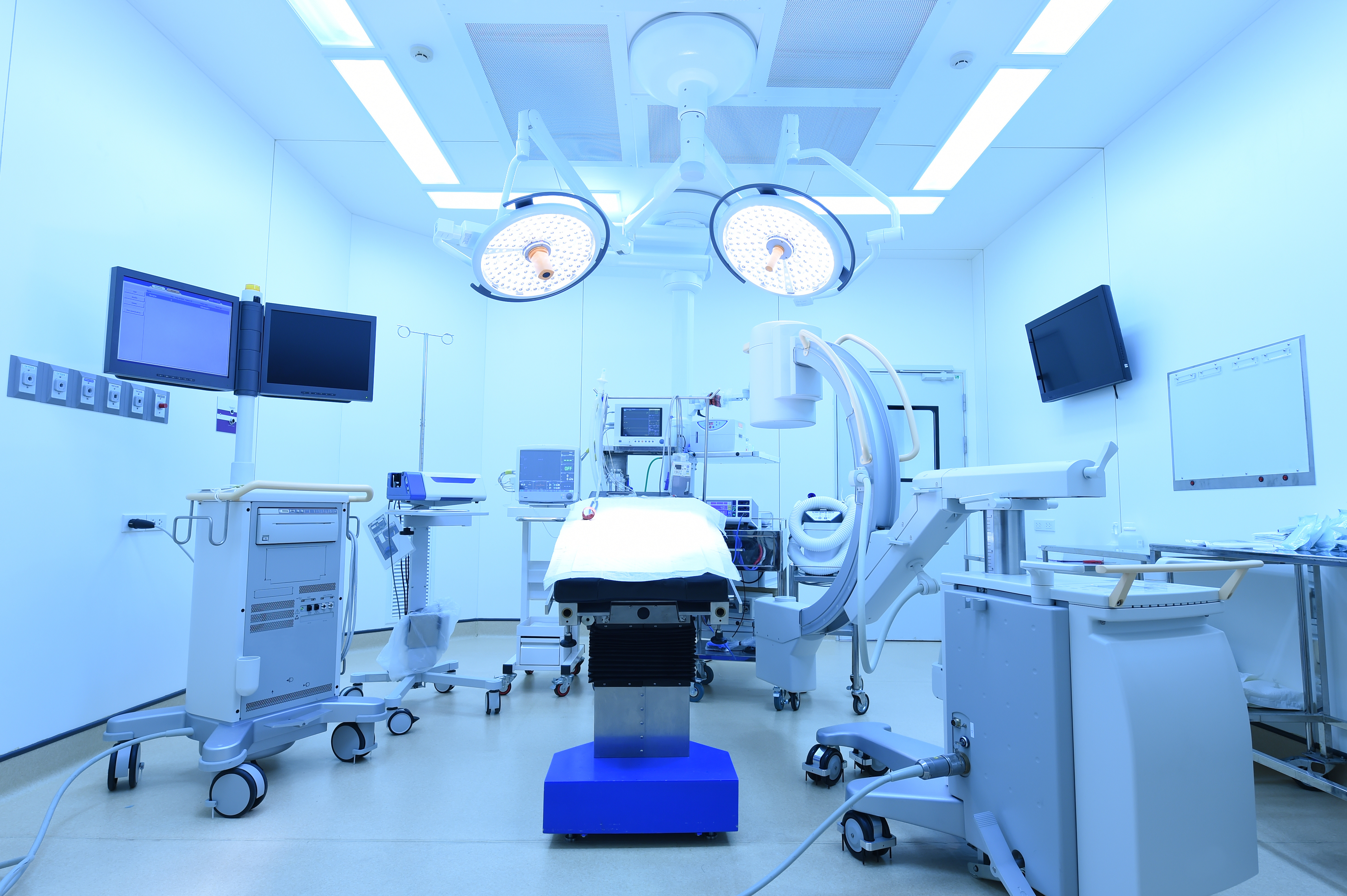 equipment and medical devices in modern operating room take with art lighting and blue filter